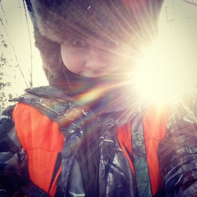 Emilee Nelson soaking in the sunrise while hunting.