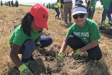 Stuart Place Elementary students planting during Rio Reforestation. Photo by USFWS.