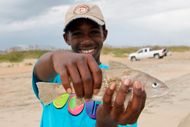 An enthusiastic participant in the Youth Food Equity Exchange. Photo by Natalie Abbassi.