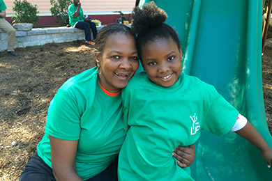 Mrs. Patricia Campbell and her granddaughter at the volunteer tree planting event before the grand opening of Lindsay Street Park. Photo by Shannon Lee.